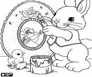 Rabbit painting an Easter egg coloring page