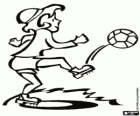 A female soccer player shooting the ball