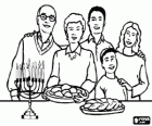 Family in the celebration of Hanukkak or Chanukah with the nine-branched candelabrum hanukiah and typical foods of the feast, levivot and sufgainot