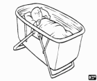 Baby sleeping peacefully in his travel crib or infant bed