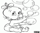 Baby girl playing to make bubbles