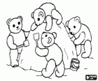 Teddy bears playing on the beach doing a large mountain of sand