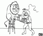 Lion sitting on a stool beside its trainer with a whip and a chair in his hands