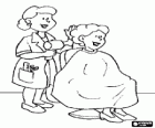 Hairdresser combing and drying the hair to a client in the beauty salon or the hairdressing salon