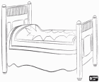 Bed with bedspread and decorated headboard and footboard