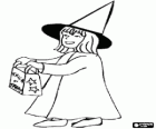 Girl dressed as witch doing Trick or Treat on Halloween