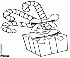Candy canes with a ribbon and gift box with bow