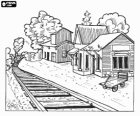 A train station in the Old West with the steam train arriving