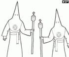 Nazarenes or penitents in a procession during Holy Week with hood or cone, robe and cape