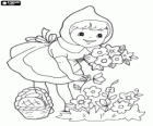 Little Red Riding Hood entertains in the forest picking flowers on the way home from her grandmother