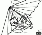 Dog flying a hang glider or delta plane, the pilot is suspended by harnesses from the device without motor