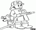 Young firefighter with the hose ready with his dog