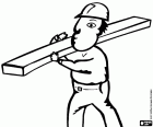 Construction worker carrying a wooden plank on his shoulder