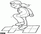 Girl playing hopscotch, jumping on one foot from square to square