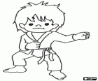 Child practicing martial arts, training karate with the uniform karategi: jacket or kimono, pants and belt
