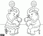 Two circus elephants juggling balls with their trunks