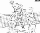 Attack on the network and the defense attempt to block in a volleyball match
