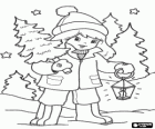 Girl in the woods carrying a small Christmas tree and a lantern