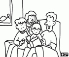 Family sitting on the sofa reading a book