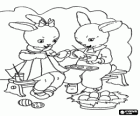 A couple of bunnies are painting eggs for Easter