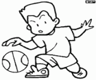 Boy playing basketball. Child bouncing the ball