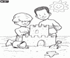 Children building a beautiful sand castle on the beach