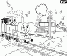 The steam engine Thomas in a level crossing with barrier