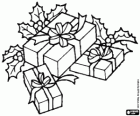 Christmas gifts with ribbons and holly leaves