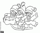 Three young children on a sled for Christmas