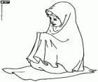 A Muslim little girl praying