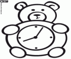 An alarm clock for children in the shape of a teddy bear