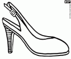Female shoe with a strap and buckle behind the ankle
