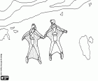 Two bird men feel a natural flight in a descent over the coast. The jumpers are equipped with wings costume and helmet, also have a parachute for landing. The wingsuit flight is a very dangerous extreme sport