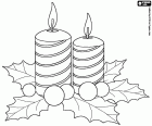 An ornamental element for the Christmas table formed by two candles, holly leaves and decorative balls