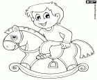A little child riding a rocking horse. This is a classic toy, a fun childhood activity