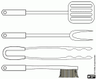 A set of utensils for barbecues. A spatula, a fork for meat, a long pair of tweezers and a brush with metal bristles