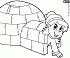 A little girl at the entrance of an igloo, a fun and interesting activity in winter