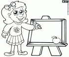 The little girl with a chalk draws on a small blackboard
