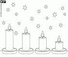 Four lit candles on the table, placed in a line and ordered from highest to lowest, on a background of stars to decorate Christmas celebrations