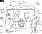 A girl and two boys are contemplating a life-size nativity scene with the Holy Family under the roof of a stable crowned with the star of Bethlehem