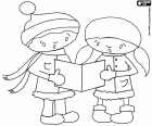 A boy and a girl are singing Christmas carols with a sheet music in their hands